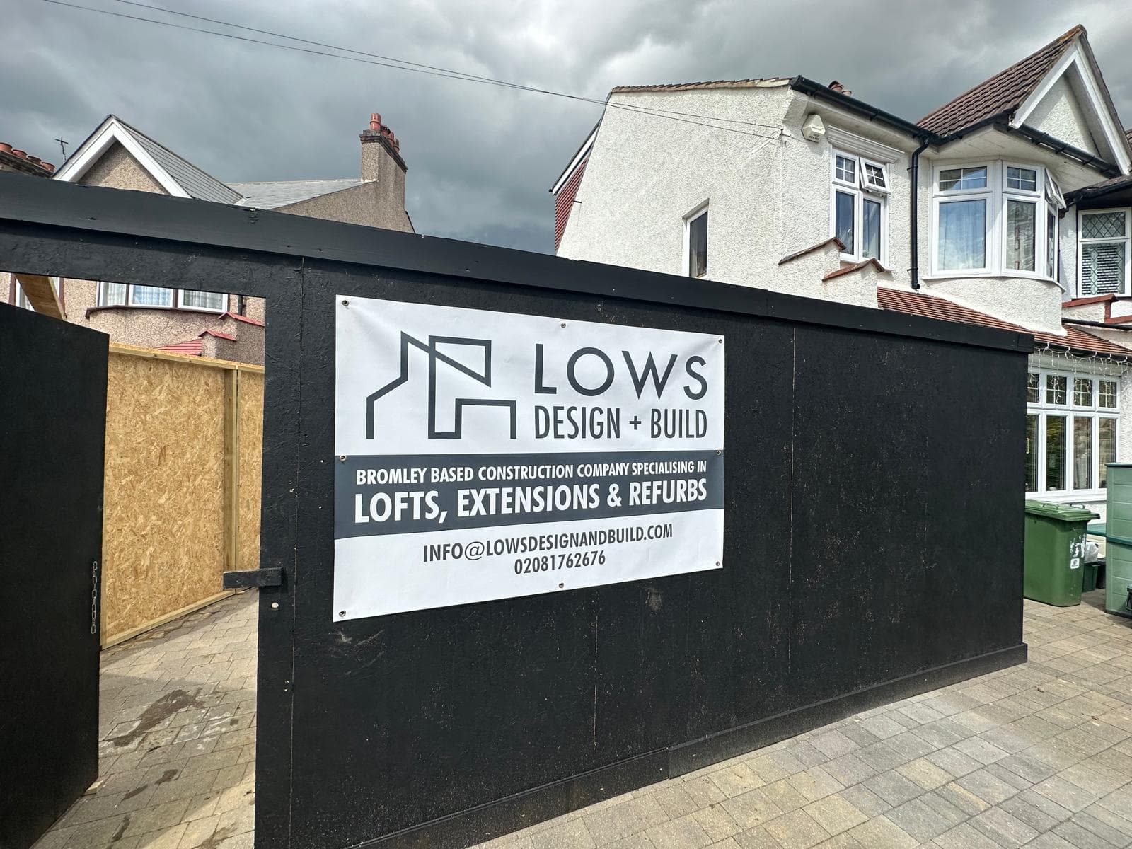 Lows Design and Build site hoarding, brand identity on construction site fence at street scale
